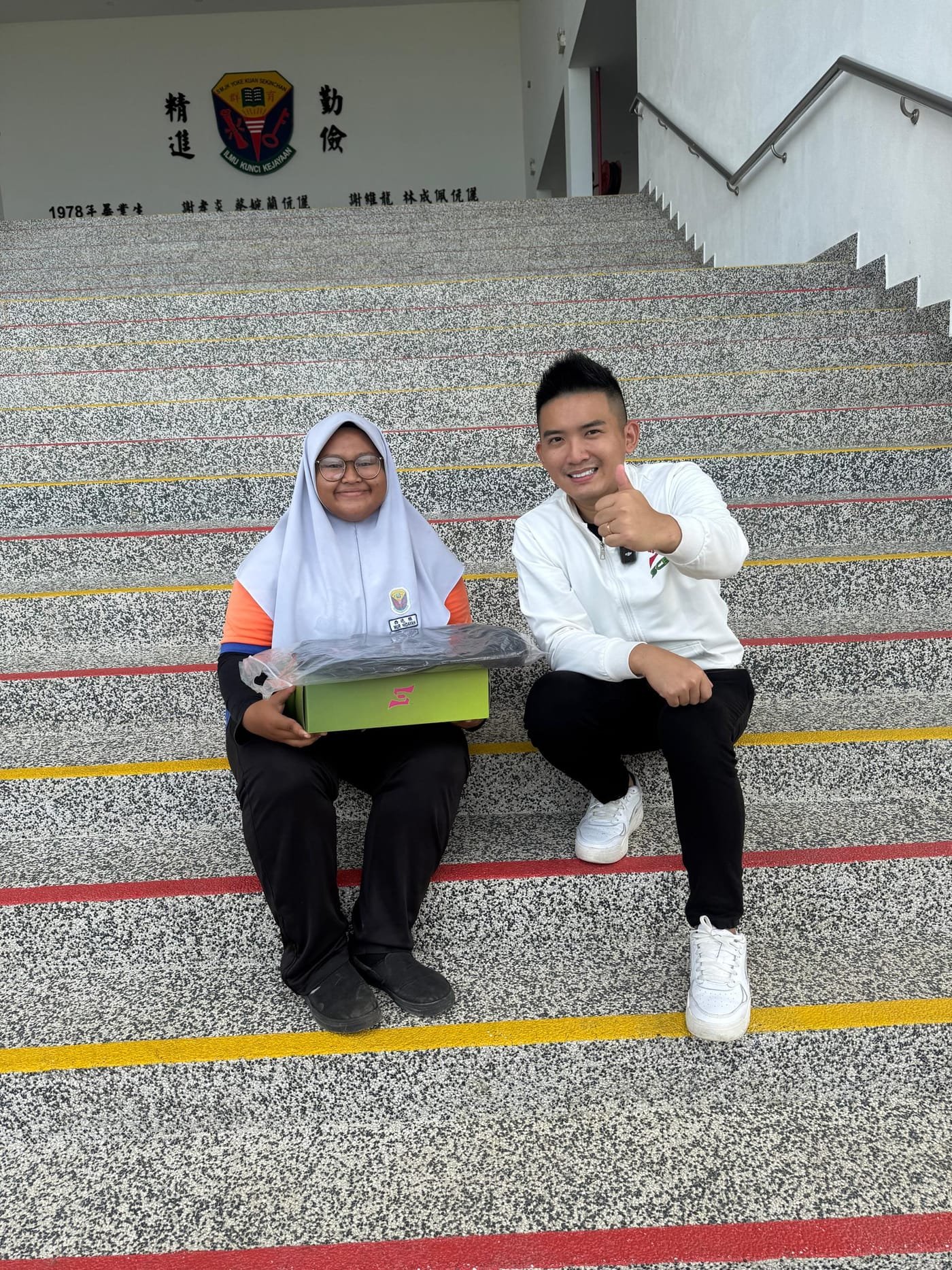 Student receiving a laptop